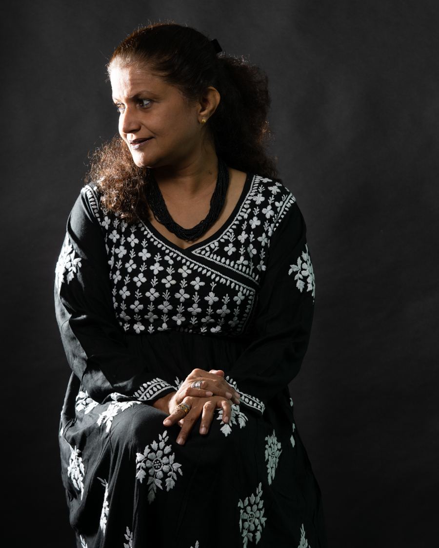 Tasneem Bhopalwala, seated, in a black chikankari kurta